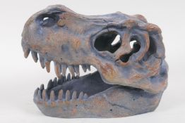 A composition dinosaur skull, 20cm long
