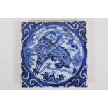 A Chinese blue and white porcelain temple tile decorated with kylin, 20 x 20cm