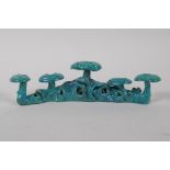 A Chinese turquoise glazed porcelain brush rest, impressed seal mark to base, 20cm long