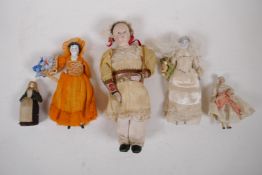 A collection of C19th porcelain and composition dolls in tailored clothing, largest 23cm