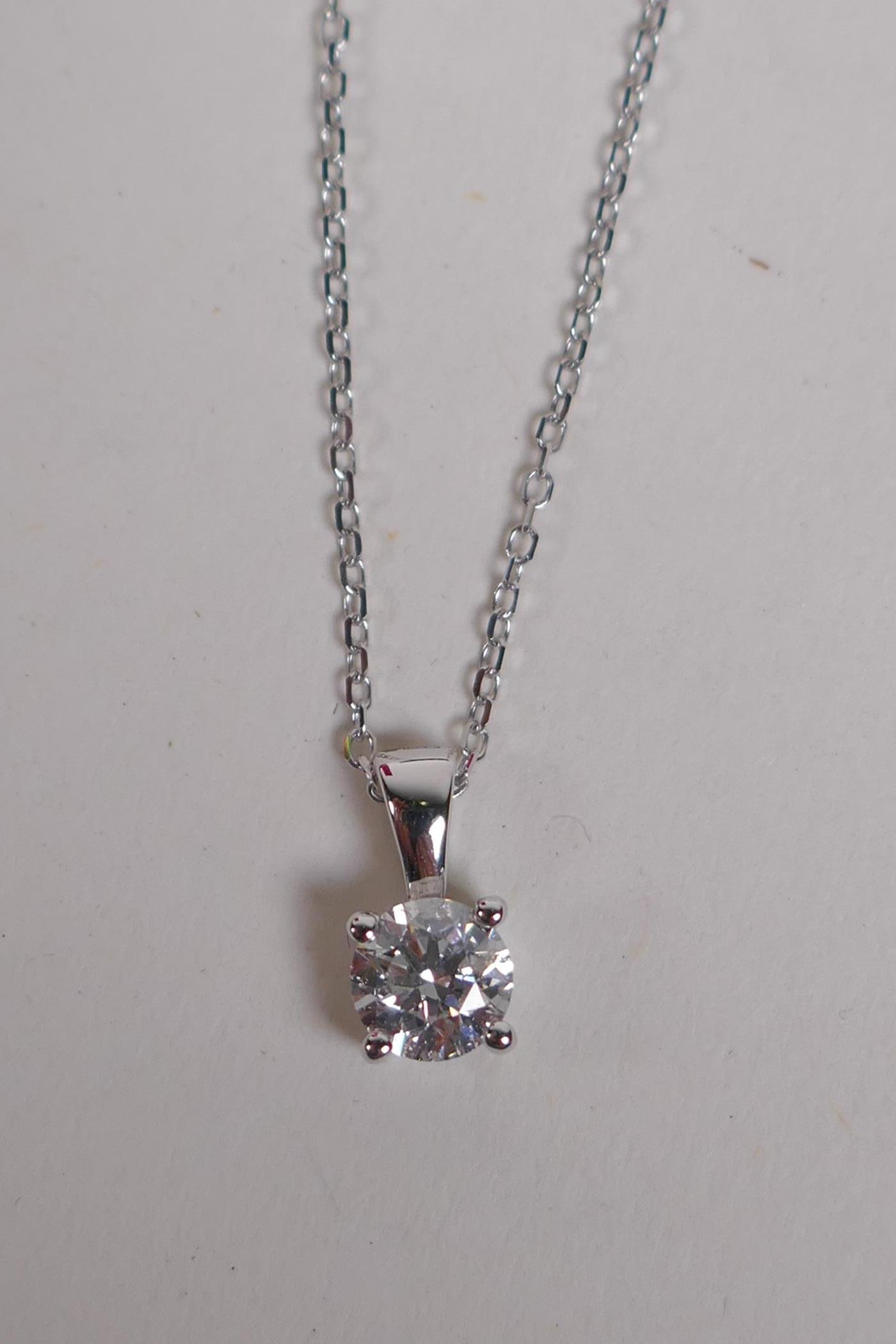 An 18ct white gold and diamond pendant necklace, approx 41 points