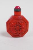 A Peking glass snuff bottle with raised bat decoration, 6cm high