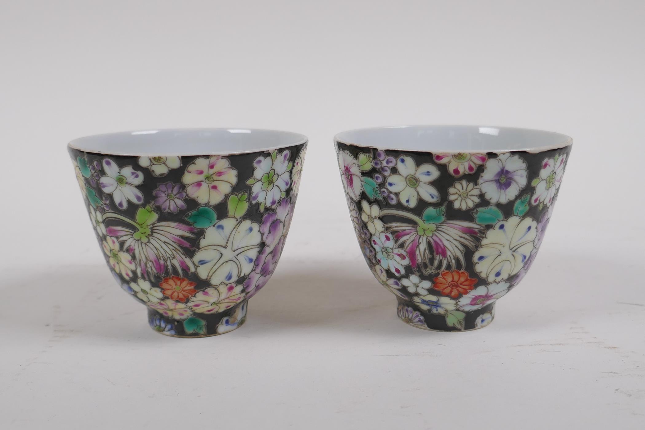 A pair of late C19th/early C20th famille noir porcelain tea bowls with floral decoration, Chinese - Image 2 of 4