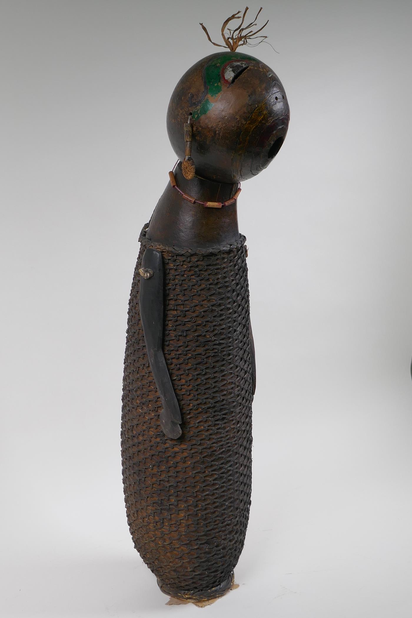 An African basket work and hollowed gourd doll with painted details, possibly Congolese, 59cm high - Image 3 of 3