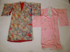 An early C20th Japanese padded silk kimono with a fan and flower design, and another crushed silk