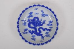 A blue and white porcelain cabinet dish with lobed rim and dragon decoration, Chinese Kangxi 4