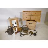 A small pine four drawer chest, a single door bathroom cabinet, pine box, brass jam pan, shop bells,
