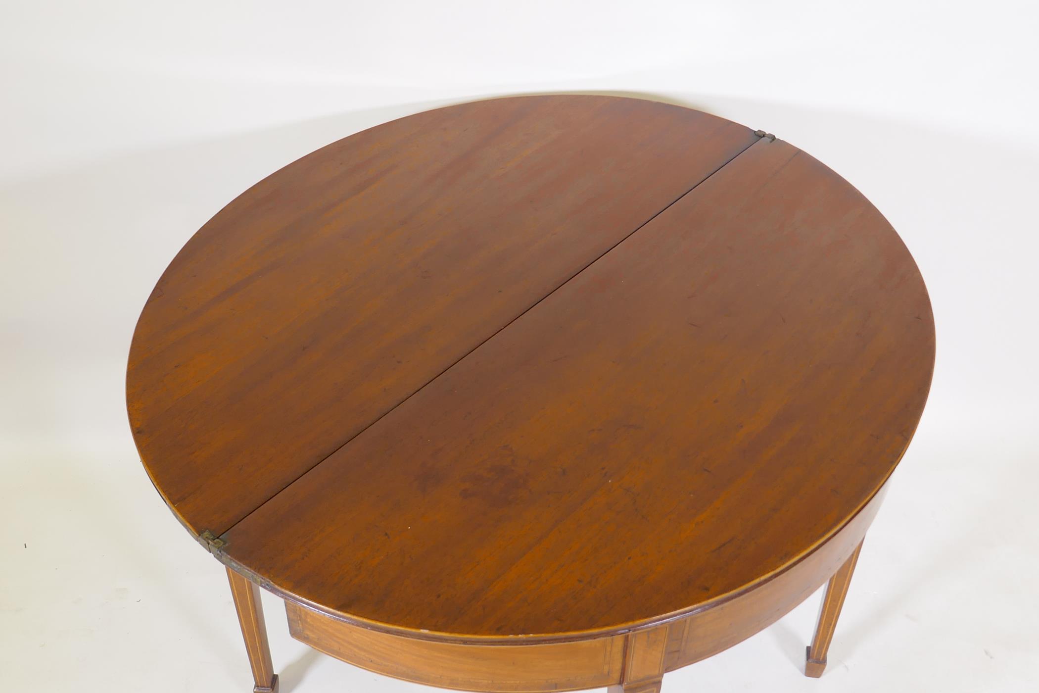 Georgian mahogany demi lune tea table, with crossbanded top and inlaid stringing, raised on square - Image 3 of 4