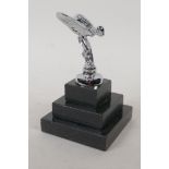A small Spirit of Ecstasy silver plated paperweight on a stepped plinth, 12cm high overall