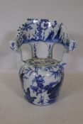 A Chinese ceramic garden seat with blue and white decoration, 65cm high