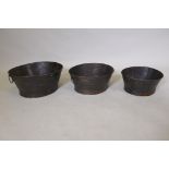 A set of three graduated oval metal planters each with two ring handles, largest 44 x 40cm