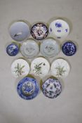 A pair of C19th Chinese export ware porcelain cabinet plates with famille rose enamel floral