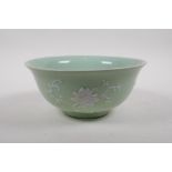 A celadon glazed porcelain bowl with raised white enamel floral decoration, Chinese Qianlong seal