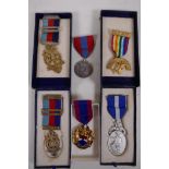 A hallmarked silver masonic medal with ribbon bar, and five other masonic medals, one dedicated to