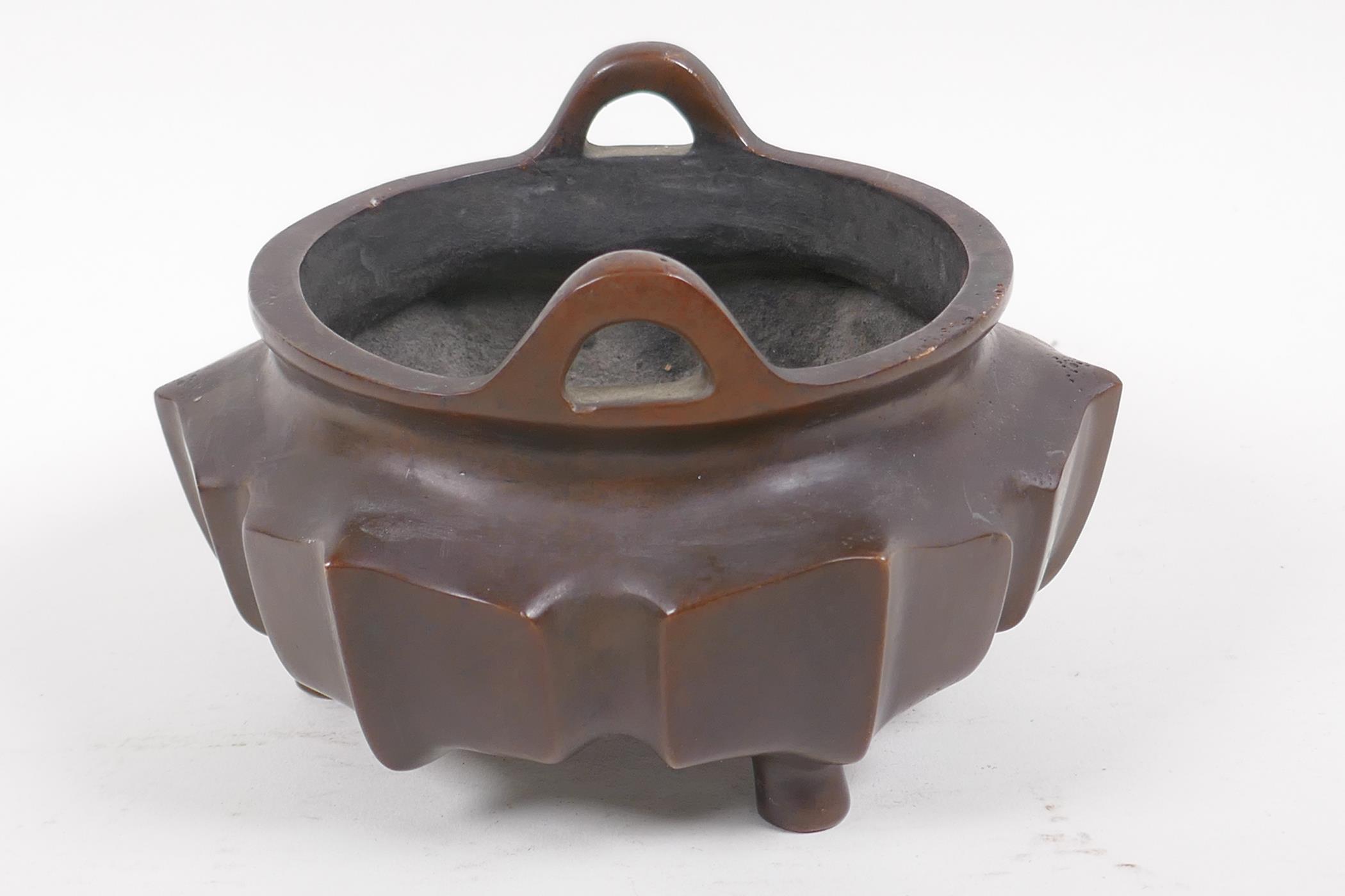 A Chinese lotus flower shaped bronze censer with loop handles on tripod supports, impressed - Image 2 of 5