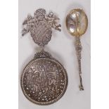 A silver caddy spoon embossed with figures and angels, marked BML 925 and maple leaf, 11cm long,