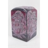 A large Chinese reconstituted soapstone seal decorated with figures in a landscape, 17cm high
