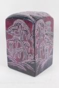A large Chinese reconstituted soapstone seal decorated with figures in a landscape, 17cm high