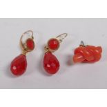 A pair of vintage yellow gold and coral drop earrings, and a single coral stud earring