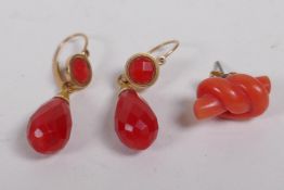 A pair of vintage yellow gold and coral drop earrings, and a single coral stud earring