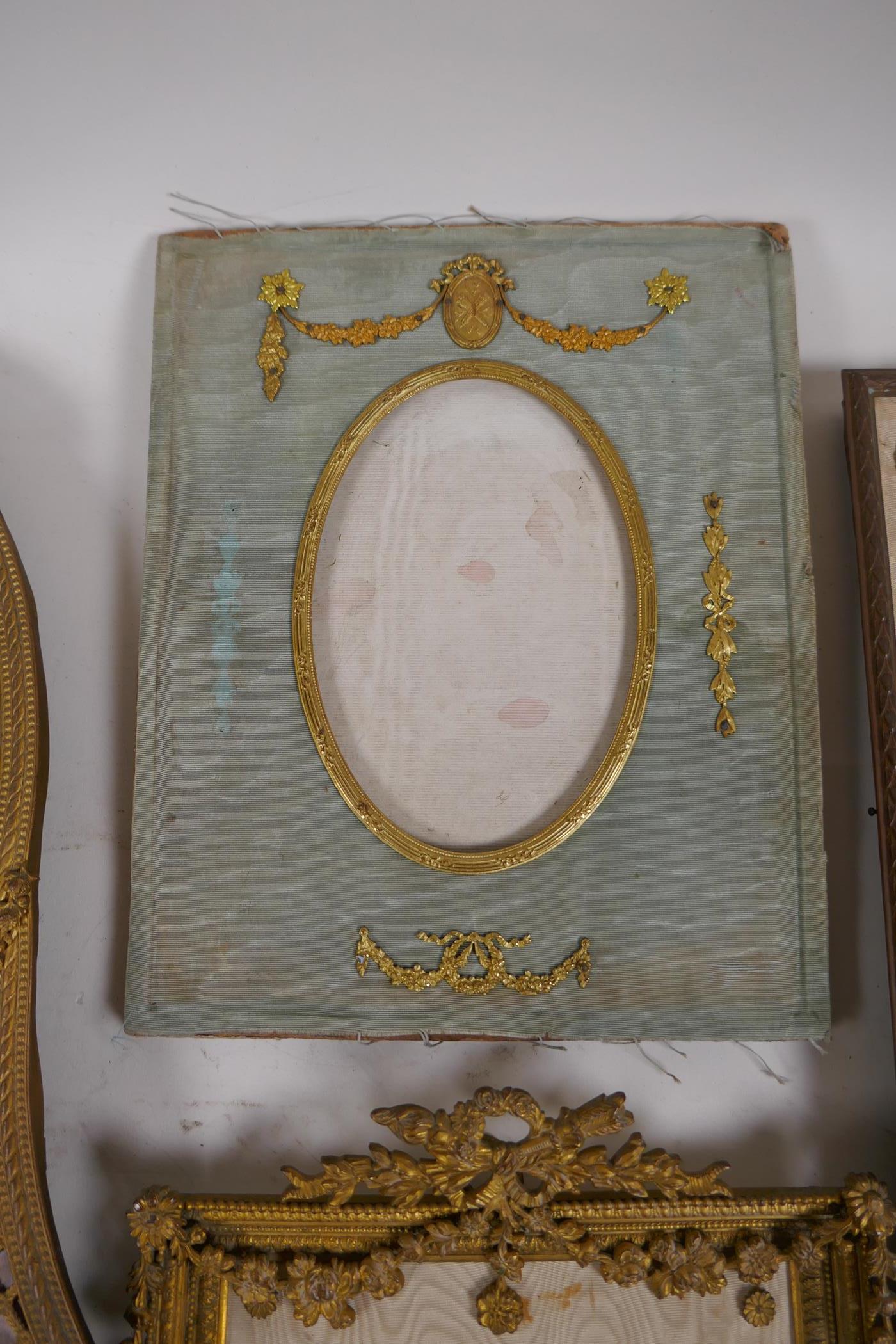 A brass and ormolu photo frame with Empire style decoration and watered silk border, late C19th/ - Image 5 of 5