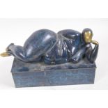 A modernist bronze figure of a reclining female nude, 29cm long