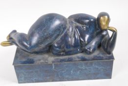 A modernist bronze figure of a reclining female nude, 29cm long