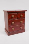 An apprentice pine chest of drawers, two short over two long, on a plinth base, 21 x 13cms, 24cms