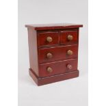 An apprentice pine chest of drawers, two short over two long, on a plinth base, 21 x 13cms, 24cms