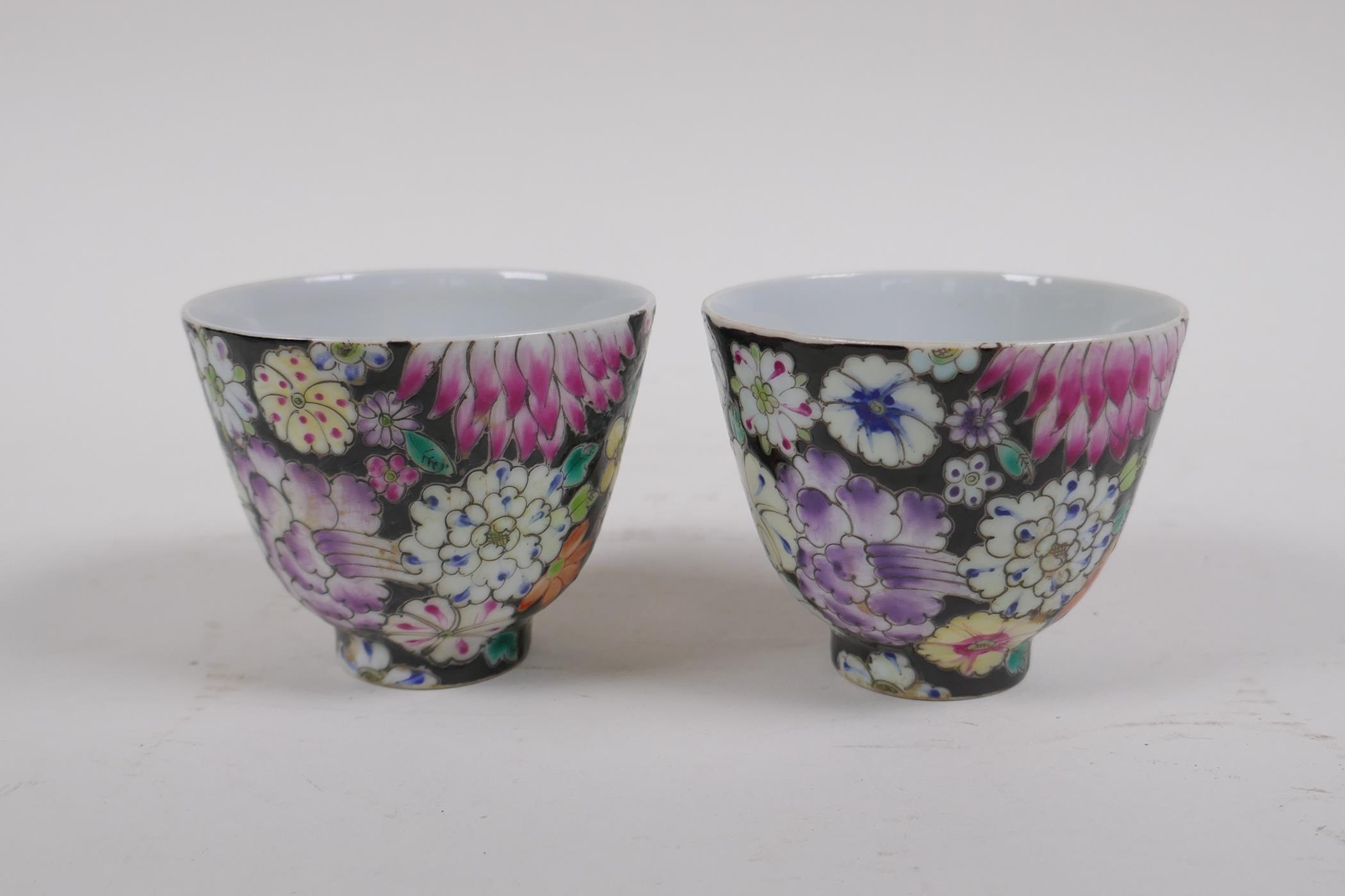 A pair of late C19th/early C20th famille noir porcelain tea bowls with floral decoration, Chinese - Image 3 of 4