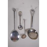 A hallmarked silver sifter spoon, George Unite, Birmingham 1905, 38g, and a small white metal