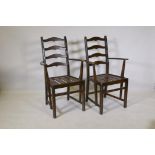 A pair of Ercol elbow chairs