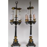 A pair of French style bronze four branch six lamp table lamps with gilt brass mounts, 76cm high