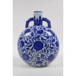 A blue and white porcelain two handled moon flask with scrolling floral decoration, Chinese Qianlong