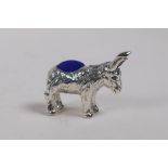 A sterling silver pin cushion in the form of a donkey, 3cm long