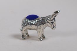 A sterling silver pin cushion in the form of a donkey, 3cm long