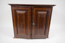 An Edwardian inlaid mahogany smoker's cabinet with fitted interior, and Doulton tobacco jar, AF,