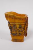 A Chinese carved bone libation cup with kylin decoration, 7cm high