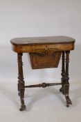 A Victorian inlaid walnut work table with lift up top and fitted interior with open fretwork