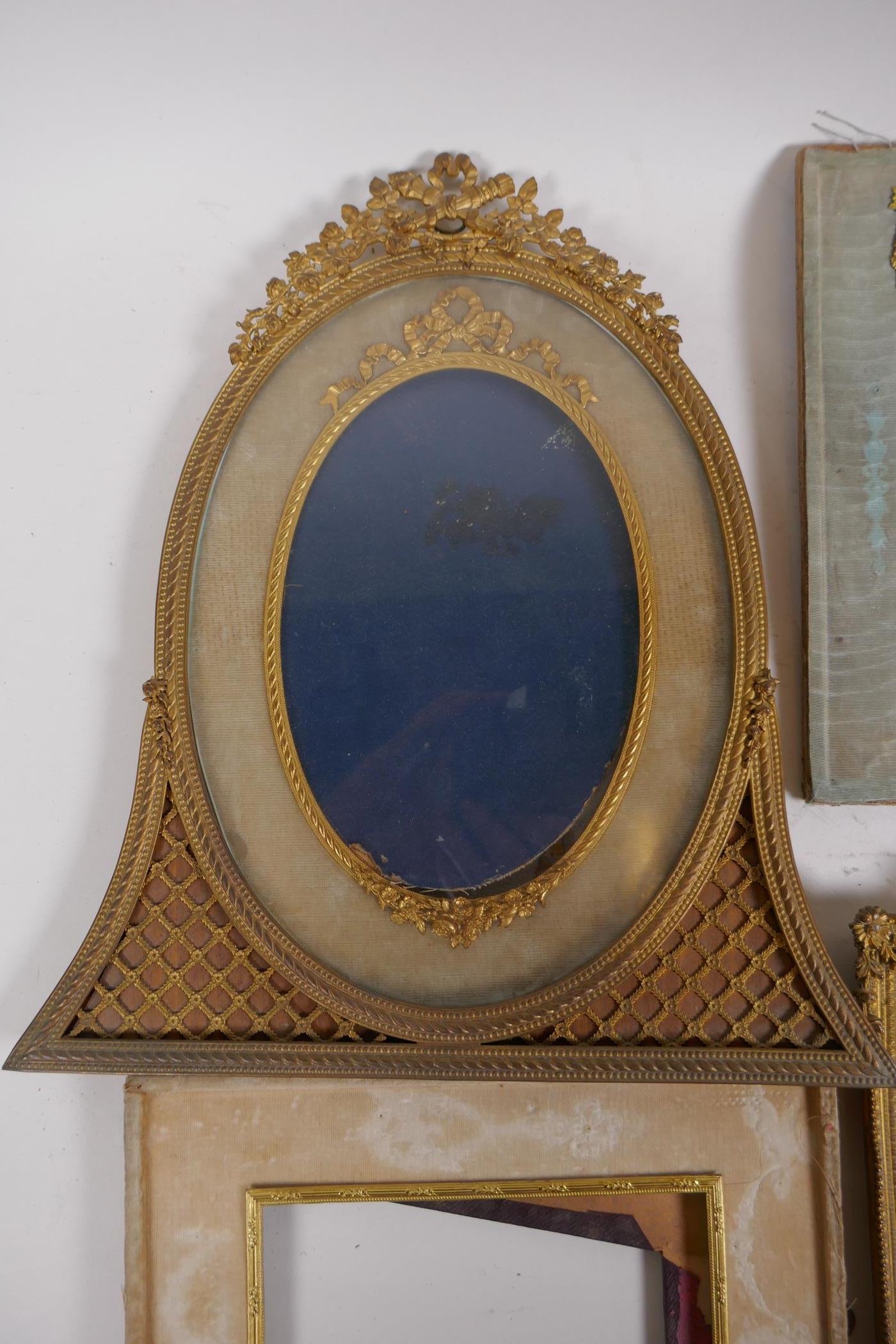 A brass and ormolu photo frame with Empire style decoration and watered silk border, late C19th/ - Image 2 of 5