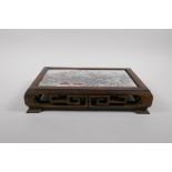 A Chinese carved hardwood stand with polychrome porcelain tile top depicting a snowy landscape, 29 x