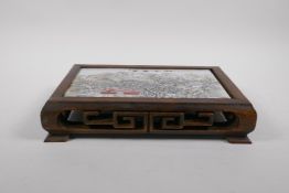 A Chinese carved hardwood stand with polychrome porcelain tile top depicting a snowy landscape, 29 x