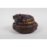 A Chinese bronze censer and cover in the form of a seated kylin with gilt highlights, impressed 4