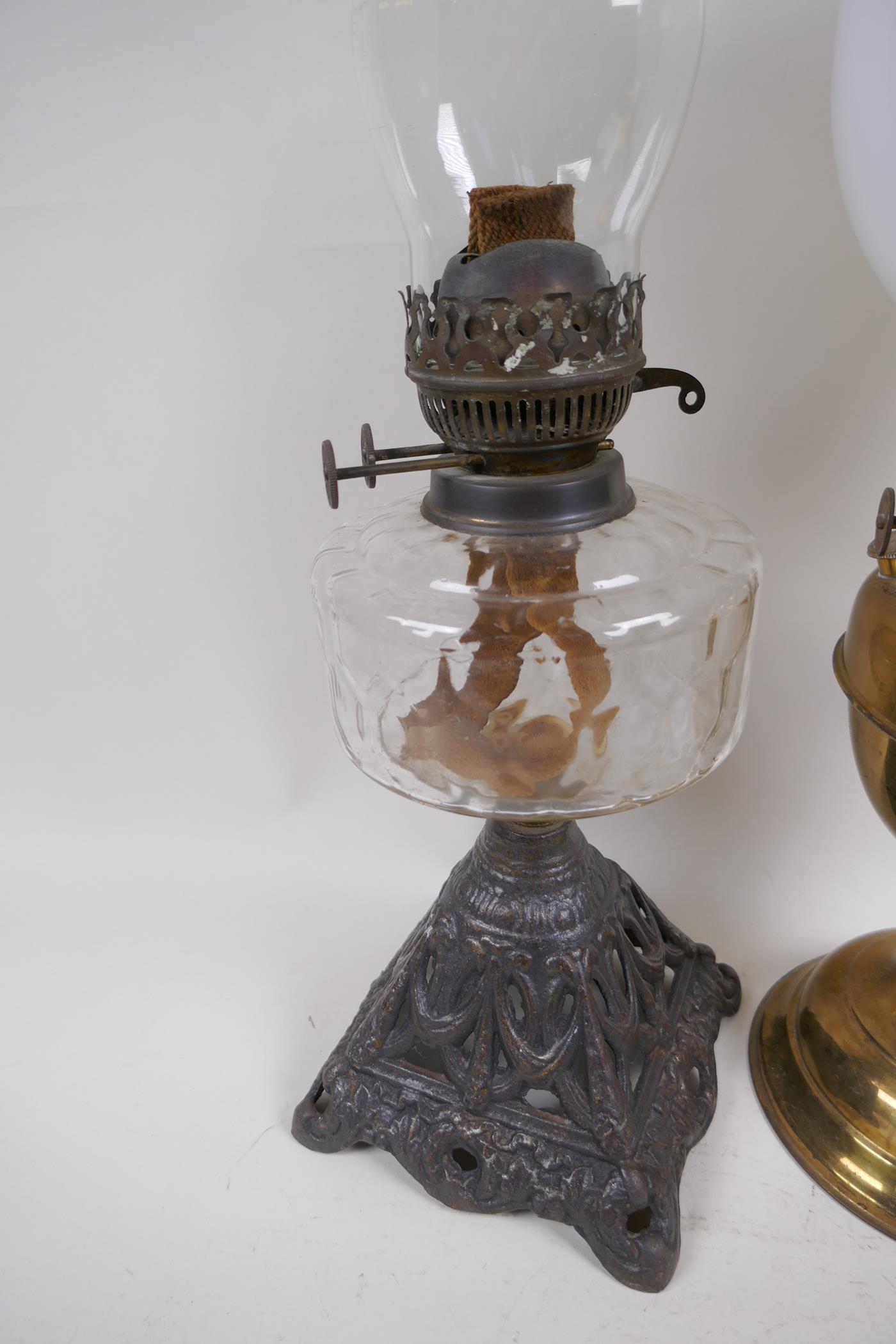 A Victorian oil lamp with cast iron base, glass font and duplex burner and glass funnel, together - Image 2 of 5