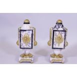 A pair of marble urns with ormolu mounts, 32cm high