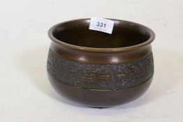 A Chinese patinated bronze censer with archaic style decoration, engraved mark to base, 17cm