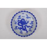 A blue and white porcelain cabinet dish with lobed rim and dragon decoration, Chinese Kangxi 4