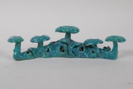 A Chinese turquoise glazed porcelain brush rest, impressed seal mark to base, 20cm long