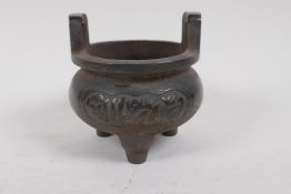 A Chinese bronze censer decorated with archaic lettering, 10cm diameter