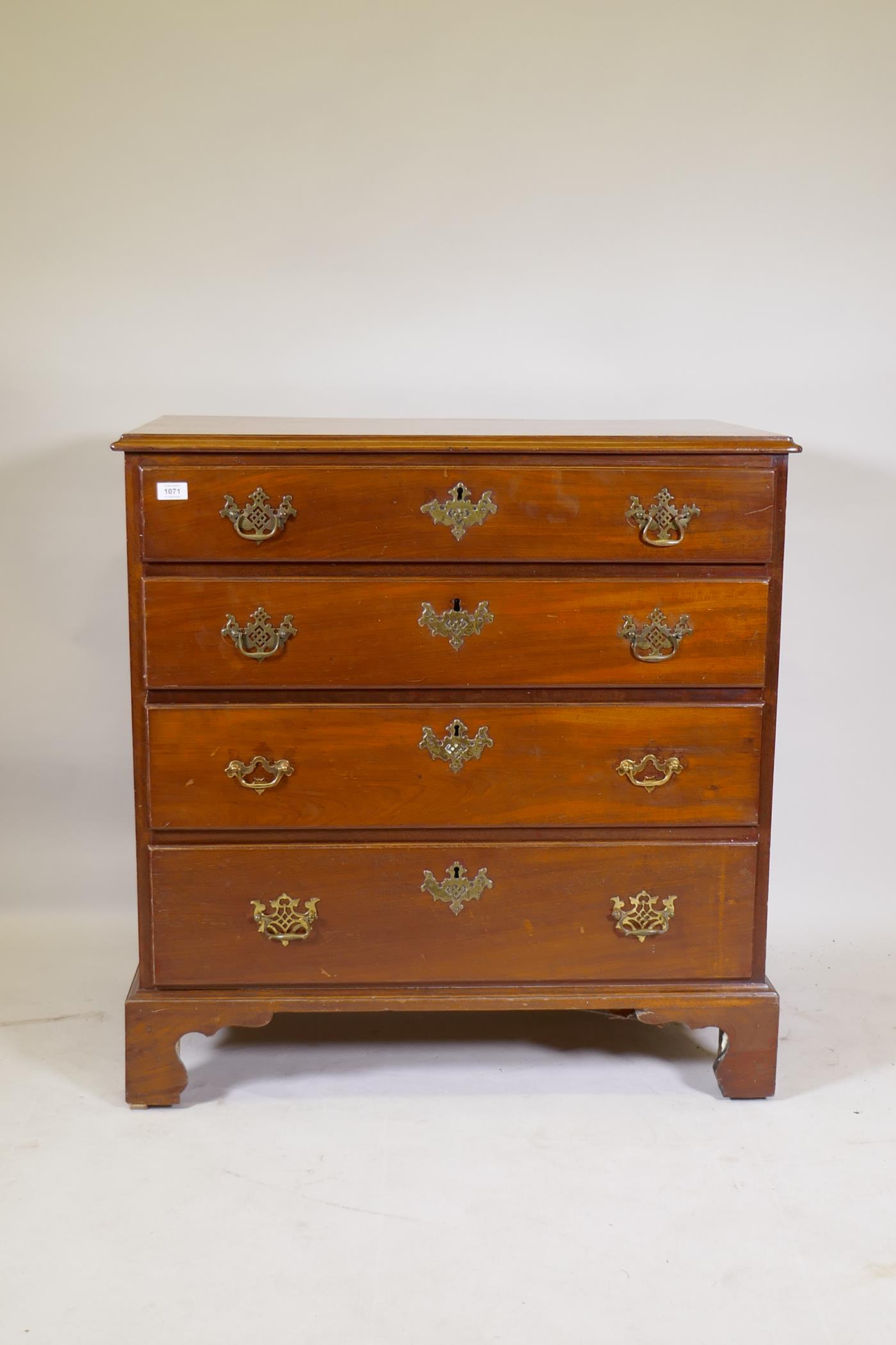 A C19th well figured solid mahogany chest of four long drawers, raised on bracket supports, 92 x